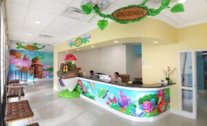 fantasy themed reception desk with candy murals and custom sculptures