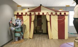 front view of medieval tent play area with elephant guard holding giant toothbrush
