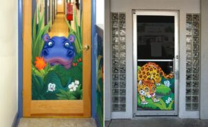 glass door mural graphics featuring hippo and jaguar characters for a kids dentistry