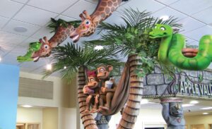 jungle animal sculptures in kids play room theater area