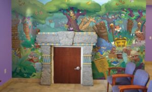 kid sized door and custom jungle mural in pediatric dentist office