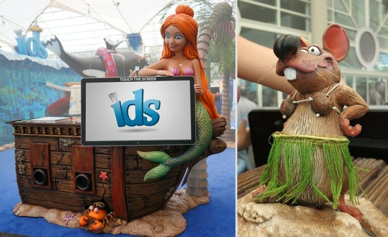 sculpted mermaid holding touchscreen display for trade show exhibit