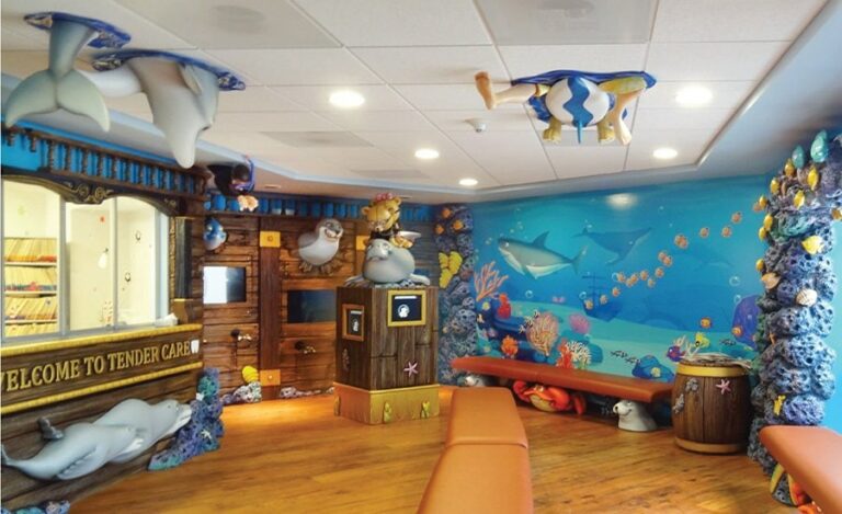 pediatric dental reception area with ocean themed sculptures and murals