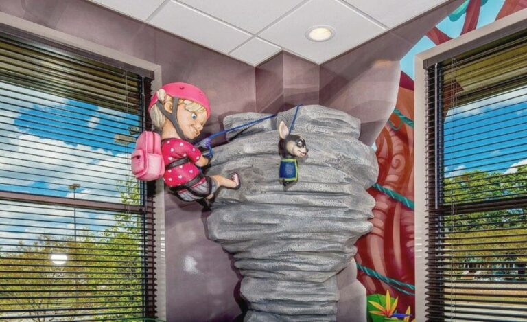 Sculpted girl character rock climbing in waiting room