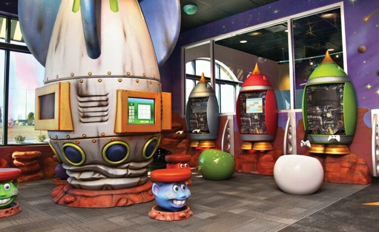 rocket ship themed kids games room in pediatric dental practice