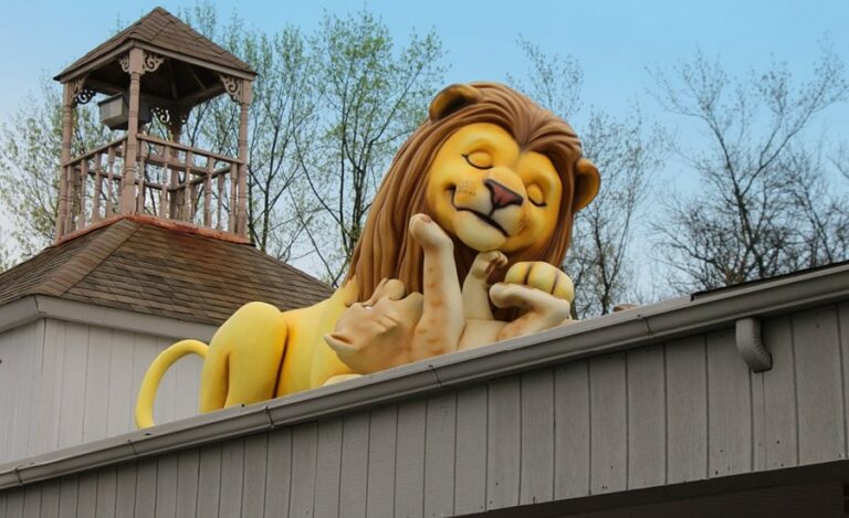 rooftop sculpture of father lion and cub for a pediatric clinic