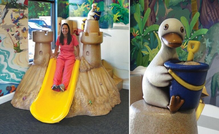 sand castle play slide in beach themed medical waiting room for kids