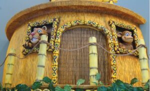sculpted bamboo hut with animal characters in a pediatric dental office