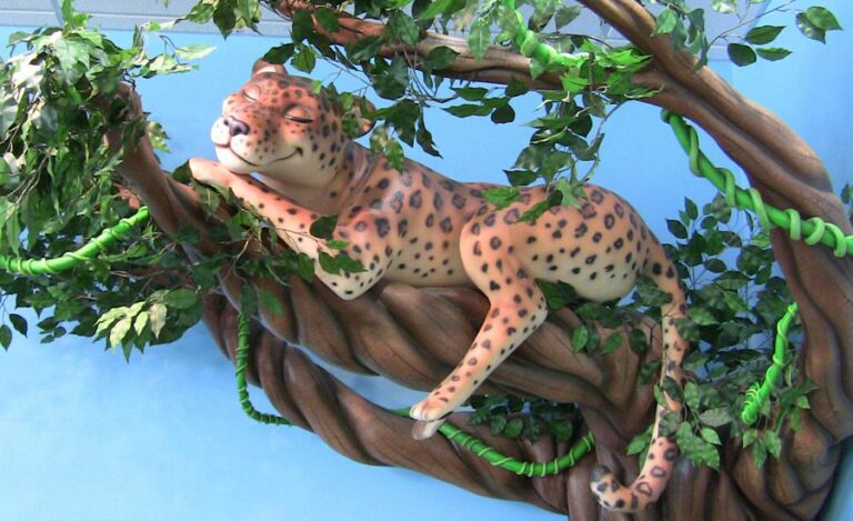 sculpted leopard laying in a tree in a kids dental office