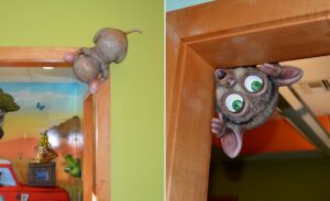 sculpted tarsier peeking from a door corned in a safari themed office