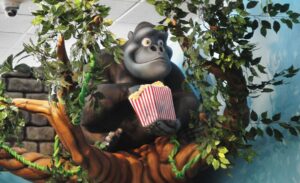 custom sculpture of a gorilla eating popcorn in sculpted tree