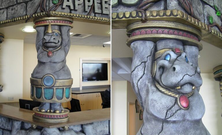 sculpted stone rhino shaped pillar on jungle themed reception desk