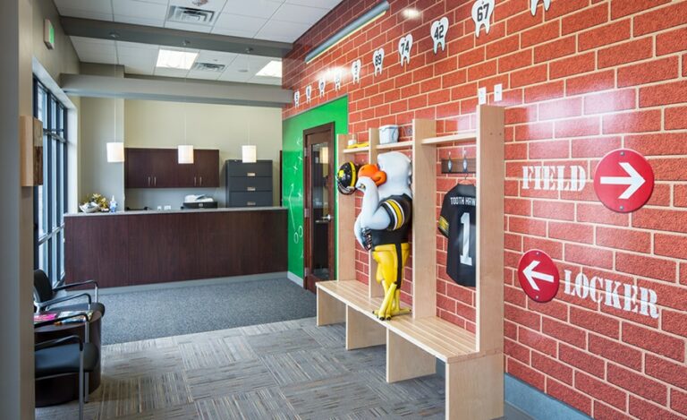 themed ortho office with sports eagle mascot and arena murals