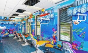 treatment open bay with a bright ocean decor and sculpted kayaking animals with waves