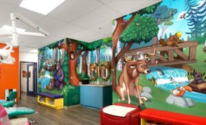 treatment room with murals and bear and beaver brushing mirrors