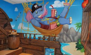 wall mural of elephant sailor in pirate themed pediatric theater
