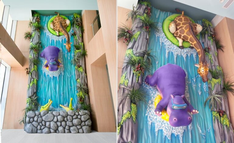 waterfall sculpture with hippo, giraffes, and crocodiles in pediatric medical clinic
