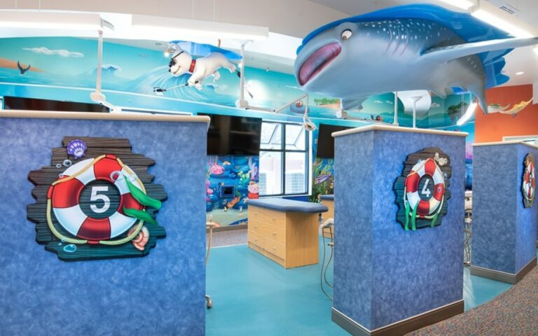 Underwater themed dental bay with a large shark hanging from the ceiling.