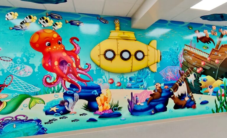 Underwater themed wall mural featuring a yellow 3D mounted submarine.