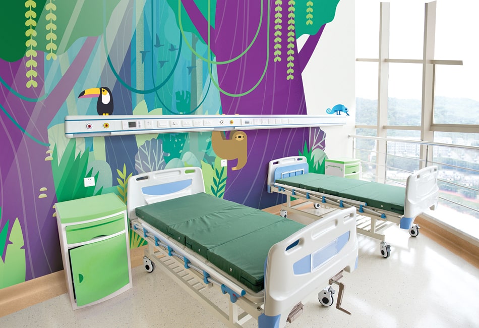 Contemporary jungle themed wall mural in pediatric hospital room.