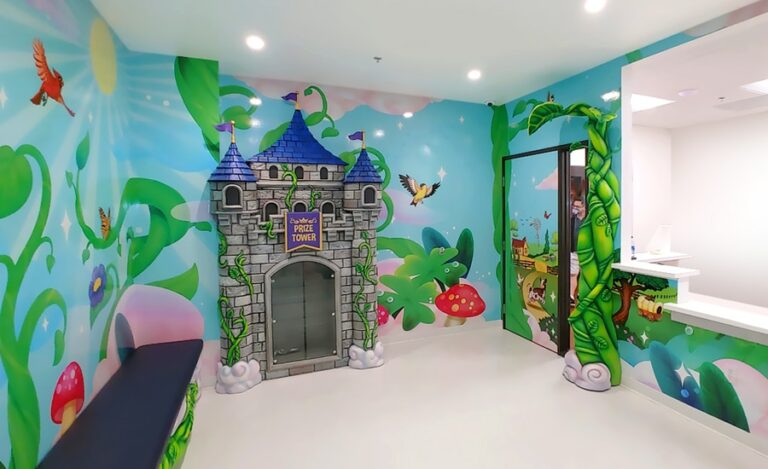 Jack and the Beanstalk story themed waiting room with castle and beanstalk murals..