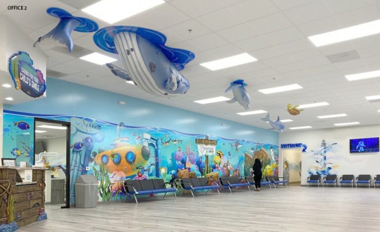 Waiting room with kid friendly underwater themed wall murals and hanging 3D aquatic characters.