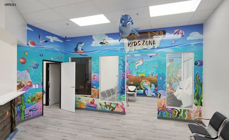 Waiting room with kid friendly underwater themed mural and hanging 3D dolphin.