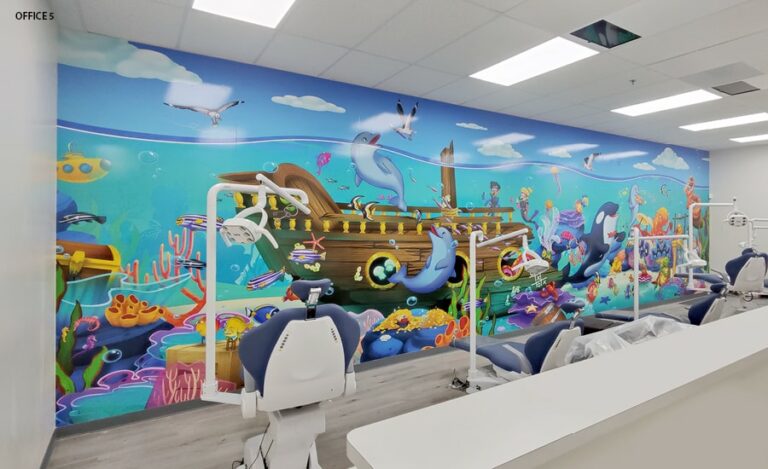 Treatment bay with kid friendly underwater themed mural.