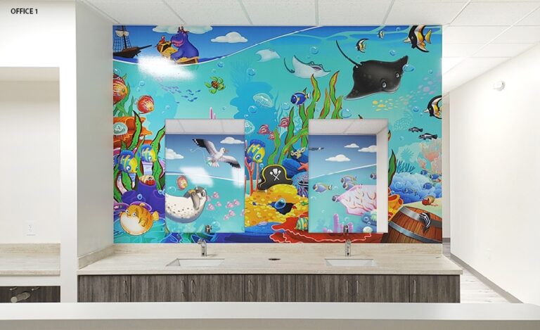 Kid friendly underwater themed mural surrounding mirrors at a dual sink brushing station.