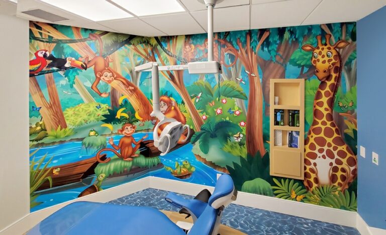 Kid-friendly jungle themed wall murals in a dental treatment room.