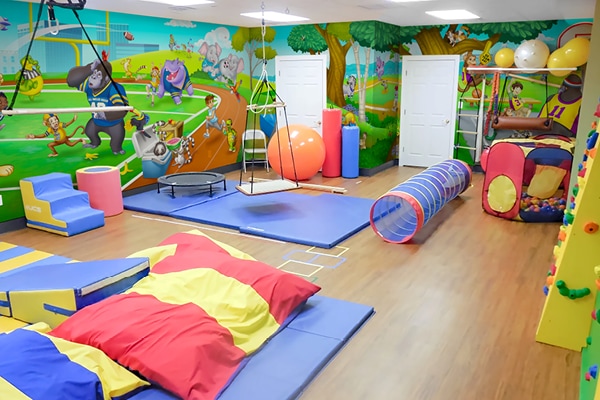 Example of a physical therapy center with sports themed animal murals.